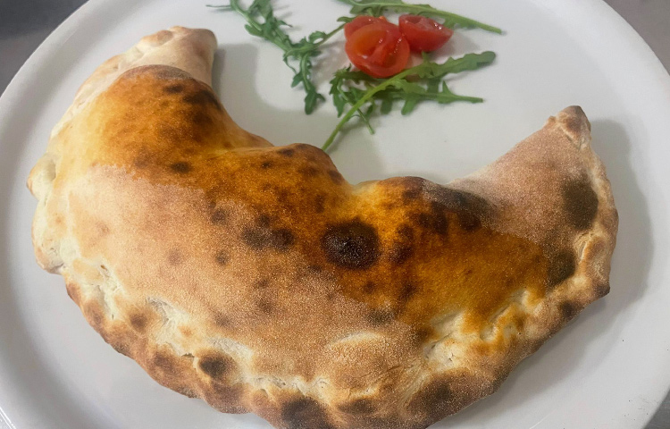 Closed calzone with vegetables